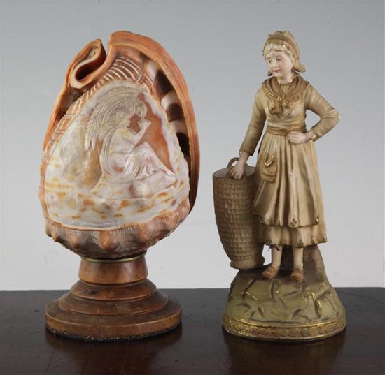 An Ernst Wahliss porcelain figural spill holder, and a cameo carved conch shell mounted as a lamp, 17.5cm